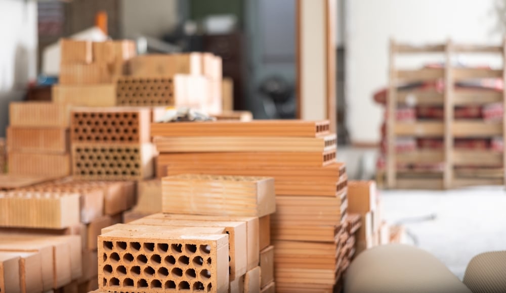 Closeup,Of,Stack,Of,Red,Bricks,Inside,Building,Under,Construction.