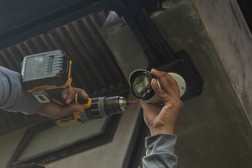 Technician,Installing,Cctv,Camera,System,For,Security,Area